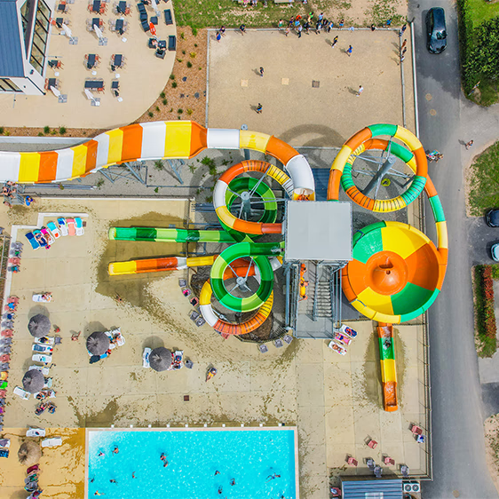 swimming pool and water slides at the campsite's water park in finistere